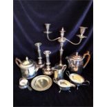 A Box of silver plated items to include a candlesticks, coffee pot etc