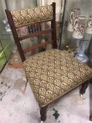 A Low Bedroom chair on ceramic castors