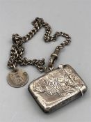 A Hallmarked silver Vesta case on a silver Albert chain