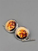 A Pair of silver and enamel cufflinks depicting a Fox.