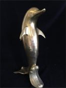 A large Brass Dolphin