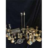 A large volume of brass items to include biscuit box, candlesticks