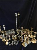 A large volume of brass items to include biscuit box, candlesticks