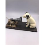 A Cast Iron HMV dog with a gramaphone