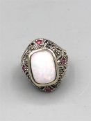 A Substantial silver marcasite ruby and central opal ring