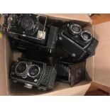 A box of various cameras