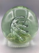A glass ball paperweight