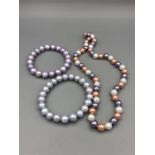 A Tri Color cultured pearl necklace with two bracelets