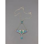 A silver and enamel butterfly style necklace