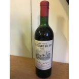 A Bottle of Chateau La Roque De By Medoc