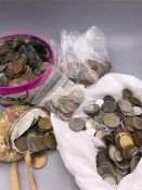 Tin containg several kilos of coins, including British pre-decimal pennies, crowns etc and large