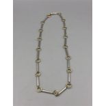 An 18ct yellow gold and silver necklace