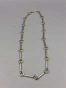 An 18ct yellow gold and silver necklace