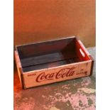 A Large wooden Coca Cola crate