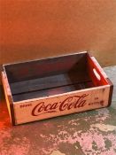 A Large wooden Coca Cola crate