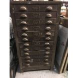 A Twelve drawer vintage metal filing cabinet with cup handles