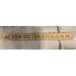 A Wooden Seven Sisters Street Sign