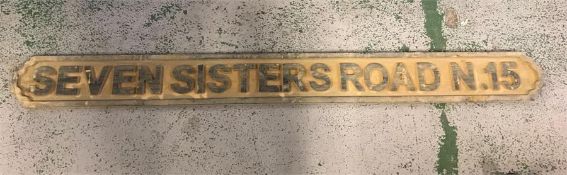 A Wooden Seven Sisters Street Sign