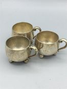 White metal cruets in the shape of mugs, marked 800 silver.