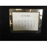 A Hallmarked silver perpetual calendar by Kitney & Co (2000 London)