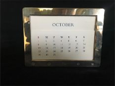 A Hallmarked silver perpetual calendar by Kitney & Co (2000 London)