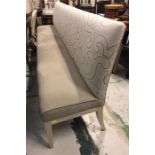 A long fabric covered bench
