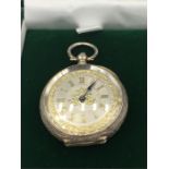 A silver ladies pocket watch