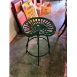 A Green tractor seat stool