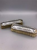 Two hallmarked silver topped brushes