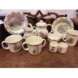 Large selection of Bunnykins china to include bowls, teapot, cups, mugs, egg cups.
