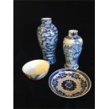 A selection of Chinese China items to include vases, bowl and a dish.