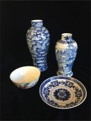 A selection of Chinese China items to include vases, bowl and a dish.