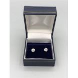A Pair of 18ct white gold diamond stud earrings of 1.1ct's