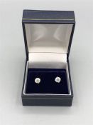 A Pair of 18ct white gold diamond stud earrings of 1.1ct's