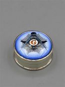 A silver pill box with enamel set Masonic symbol to the lid