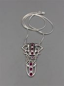 A silver CZ and Ruby necklace