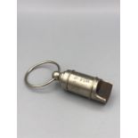 A Steel cased whistle stamped Titanic