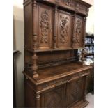 A large carved oak sideboard or buffet (232 cm x 141 cm x 54 cm)