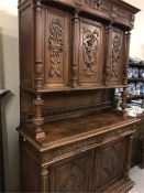 A large carved oak sideboard or buffet (232 cm x 141 cm x 54 cm)
