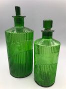 Two Medina green bottles with stoppers and