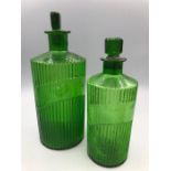 Two Medina green bottles with stoppers and