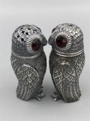 A Pair of 800 silver owl condiments with glass eyes