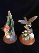 Two hand painted figures of birds
