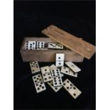 A box of Vintage bone dominoes