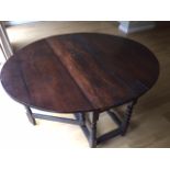 An 18th Century Drop leaf oak table