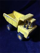 A Matchbox yellow tipper truck