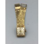 A Gold Tissot watch (Total Weight 35.7g)