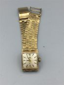 A Gold Tissot watch (Total Weight 35.7g)