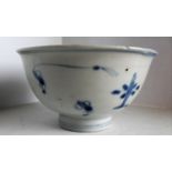 An eighteenth century Chinese blue and white porcelain tea bowl depicting jumping carp on a single