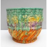 A Clarice Cliff 'Delecia' moulded and streaked planter covered in streaked coloured enamels,